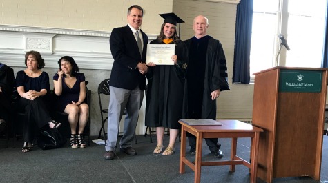 Hannah Rennolds receiving her diploma on stage
